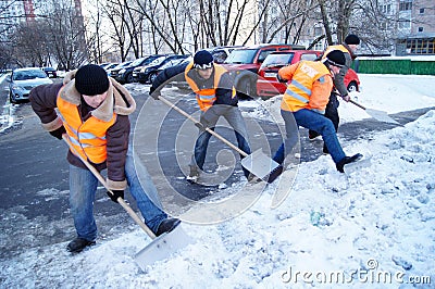 Workers clean snow Editorial Stock Photo