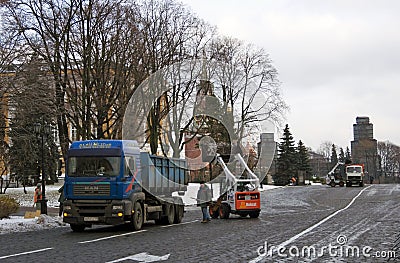 Workers clean snow in Moscow Kremlin. Editorial Stock Photo