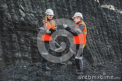 Workers with coal at open pit Stock Photo