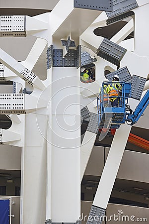 Workers on a construction site. Engineering and architectural infrastructure. Safety Editorial Stock Photo