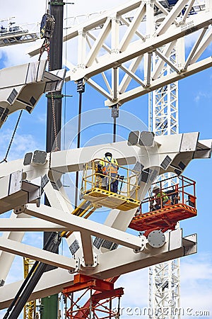 Workers on a construction site. Engineering and architectural infrastructure. Safety Stock Photo