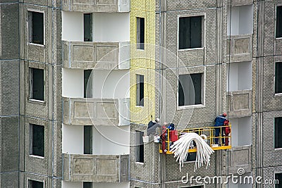 Workers at construction site Editorial Stock Photo