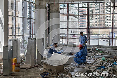 Workers in a contruction site in Dubai Editorial Stock Photo