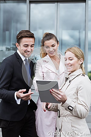 Workers of corporation with tablet Stock Photo