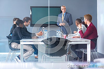 Workers discus about business at meeting Stock Photo