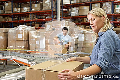 Workers In Distribution Warehouse Stock Photo