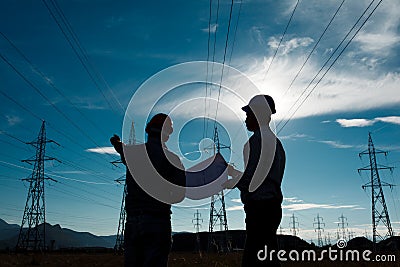 Workers at electricity station Stock Photo