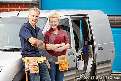 Workers In Family Business Standing Next To Van Stock Photo