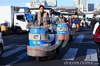 Workers at Famous Tsukiji fish market Editorial Stock Photo