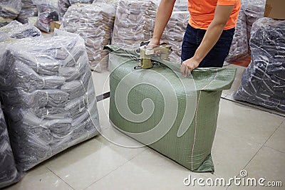 Workers in a garment factory are loading and sorting clothes Stock Photo