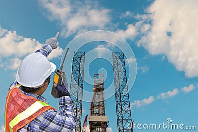 Workers hand holding communication radio and finger target Stock Photo