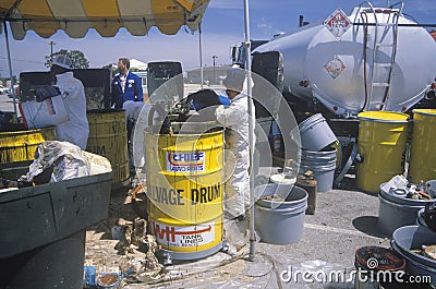 Workers handling toxic household wastes Editorial Stock Photo