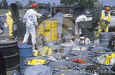 Workers handling toxic household wastes at waste cleanup site on Earth Day at the Unocal plant in Wilmington, Los Angeles, CA Editorial Stock Photo