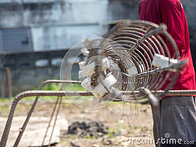 Workers hands put on gloves using hand to iron wire to tie for structure the house or building Editorial Stock Photo