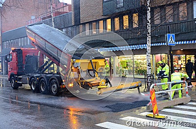 Workers Laying Asphalt Editorial Stock Photo