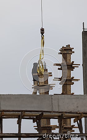 Workers makes column box and keep by crane for built column Editorial Stock Photo