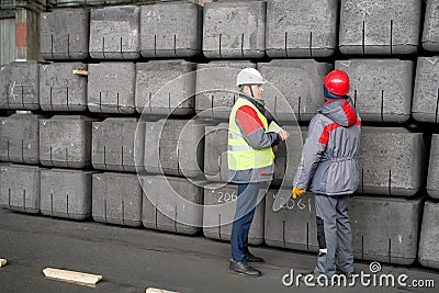 Workers Marking Blocks Stock Photo