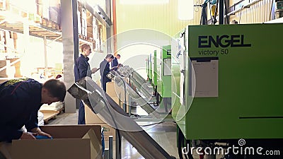 Workers Operate Equipment Manufacture of Plastic Parts Editorial Stock Photo