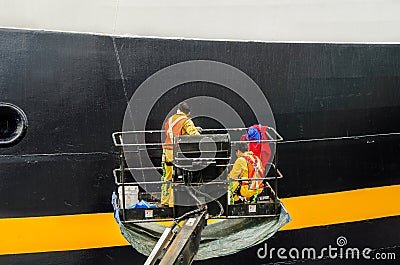 Workers Painting the Starboard of a Cruise Ship Editorial Stock Photo