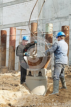 Workers at piling works Stock Photo