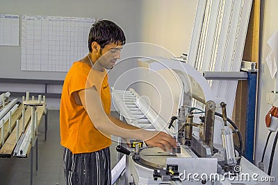 Workers at the plant for the production of plastic Windows in the Kaluga region in Russia. Editorial Stock Photo