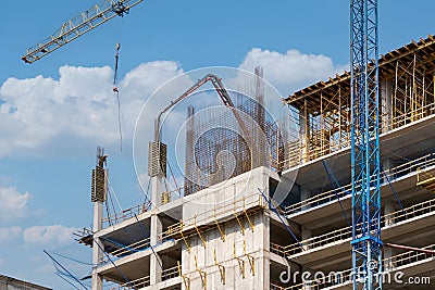 Workers pour concrete at the construction site of a new residential building Stock Photo