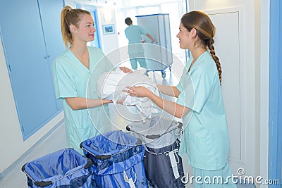 Workers preparing real bags hospital laundry Stock Photo