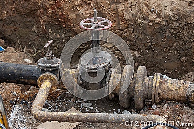 Workers of the repair team excavated pipeline Stock Photo