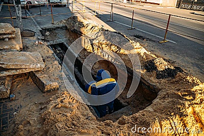 Workers repair water, drainage or sewer pipeline Stock Photo