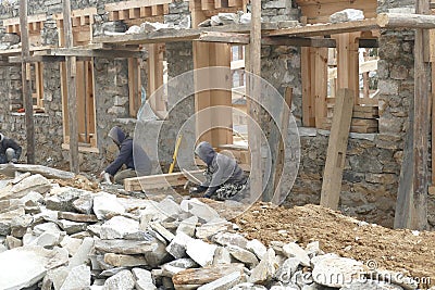 Workers restoring cells of the Gangtey Gompa Editorial Stock Photo