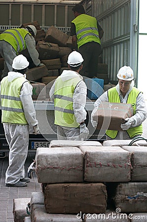 Workers retrieve drug packs from a truck before its destruction Editorial Stock Photo