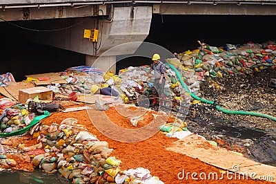 Workers in the river construction, pry an iron shelf Editorial Stock Photo