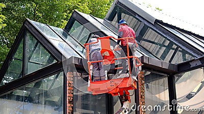 Workers stand on a nacelle elevator Editorial Stock Photo