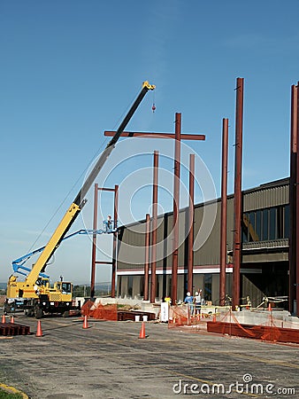 Workers and Steel Beams Stock Photo