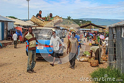 Workers at the street market unload a car with goods Editorial Stock Photo