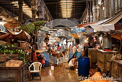 Workers and traders of the old city market clean counters and wash the floor Editorial Stock Photo