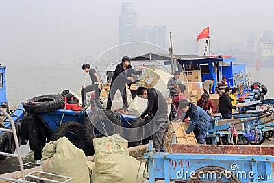 Workers unloading Editorial Stock Photo