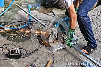 Workers use steel cutters to place various tools. recklessly placed near a water source This can cause a short circuit. Indicates Stock Photo
