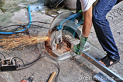 Workers use steel cutters to place various tools. recklessly placed near a water source This can cause a short circuit. Indicates Stock Photo