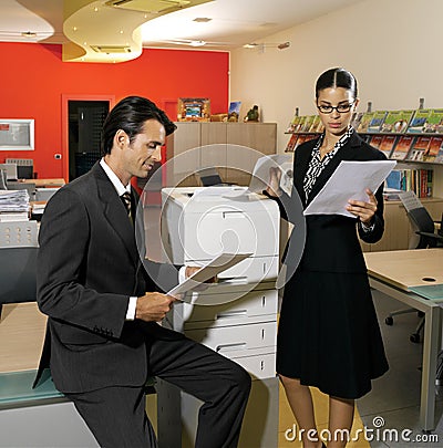 Workers using copy machine iol Stock Photo