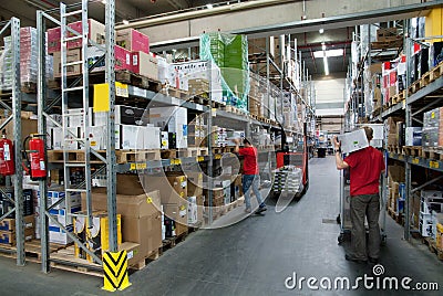 Workers in a warehouse Editorial Stock Photo