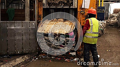 Workers at the waste processing plant. Sorting trash on a conveyor belt Editorial Stock Photo