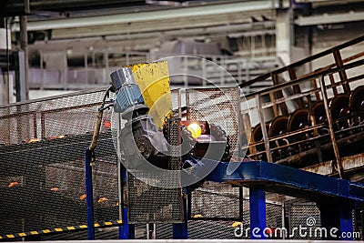 Working ball rolling mill. Production of steel grinding balls Stock Photo