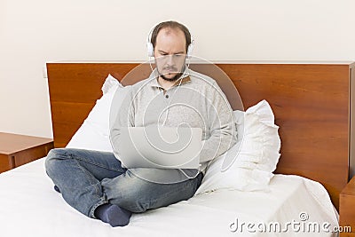 Working in bed Stock Photo