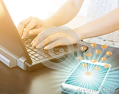 Working on a computer and have a message to enter the smartphone social media online business Message, likes, followers and commen Stock Photo