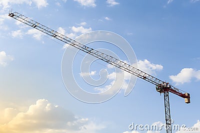 Working with a crane. Construction crane tower on blue sky background. Empty Space for text. Construction concept. Tower crane Stock Photo