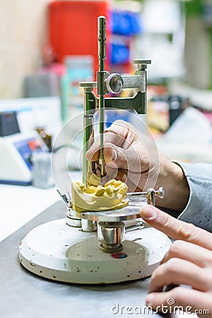 Working in a dental prosthesis Stock Photo