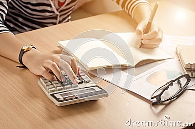 Working on a desk numerical analysis, financial accounting. Graphing Calculator. Stock Photo