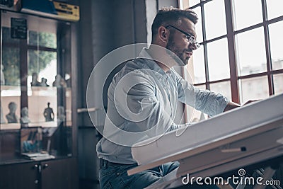 Working engineer with a drawing Stock Photo