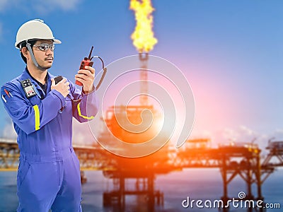 Working engineer at offshore oil and gas refinery Stock Photo